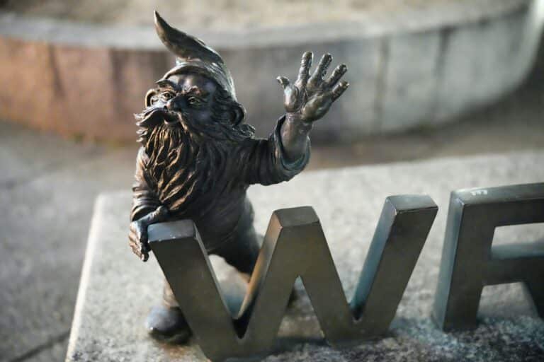 Wrocław city guide — the Market Square Town Hall at evening, fourteenth-century Gothic civic architecture rebuilt from rubble after 1945